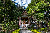 Luang Prabang, Laos - Wat Sop, pavilion with a seated Buddha statue.